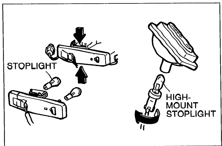 Illustration of the stoplight and high-mount stoplight bulbs with downward arrows indicating bulb removal direction. Labels STOPLIGHT and HIGH-MOUNT STOPLIGHT.