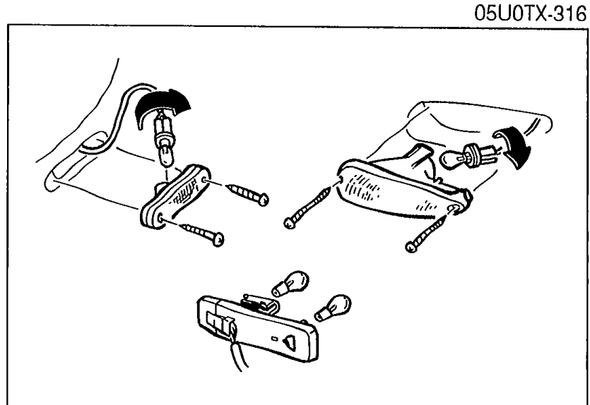 Removed bulb sockets and a lamp housing (e.g. taillight / license plate light) shown disassembled for bulb inspection.
