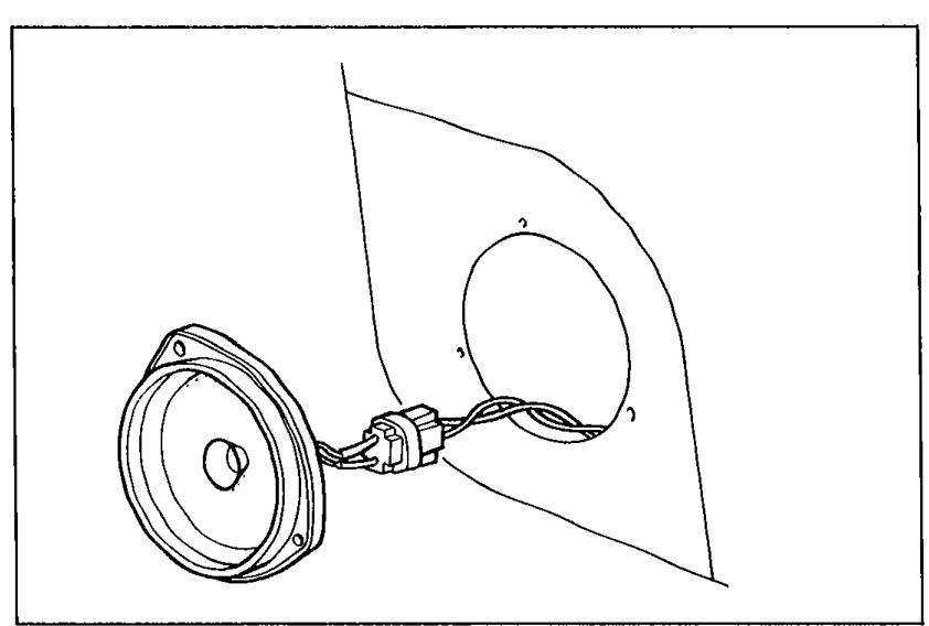 Door panel with the door speaker removed and held away on its harness. Illustrates Step 5 - removing the faulty door speaker cover and installation screws.