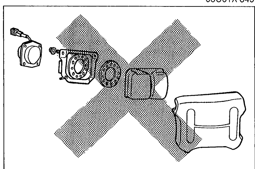 Air bag system components with a large X overlay, prohibiting disassembly.