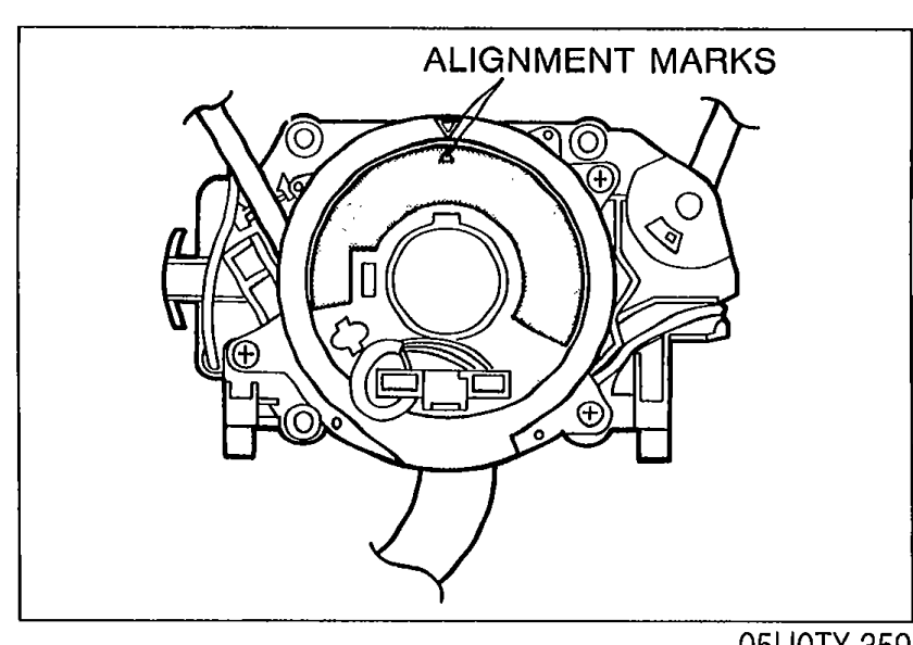 Clock spring connector showing ALIGNMENT MARKS on the outer housing.