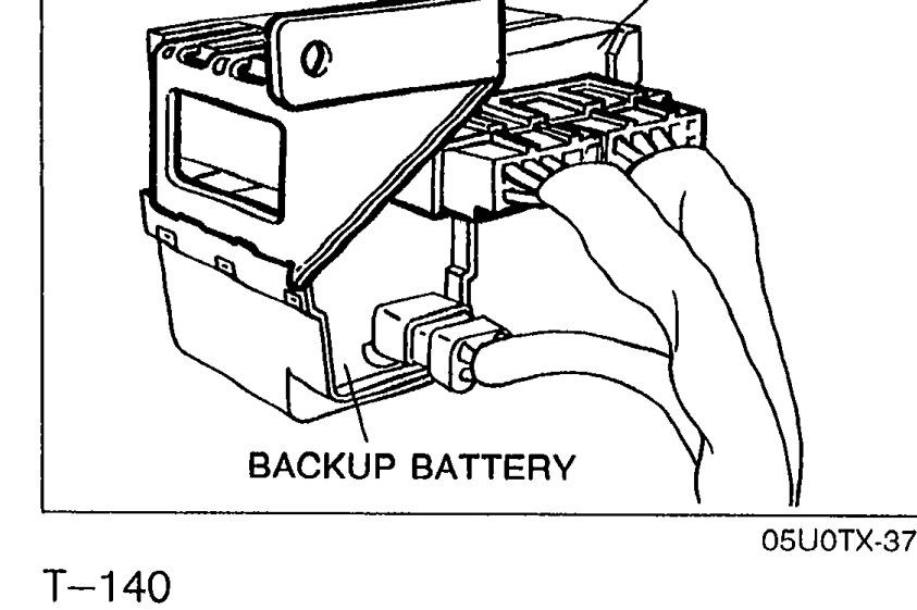 Photo showing the diagnostic module with backup battery connector. Labels point to DIAGNOSTIC MODULE and BACKUP BATTERY.