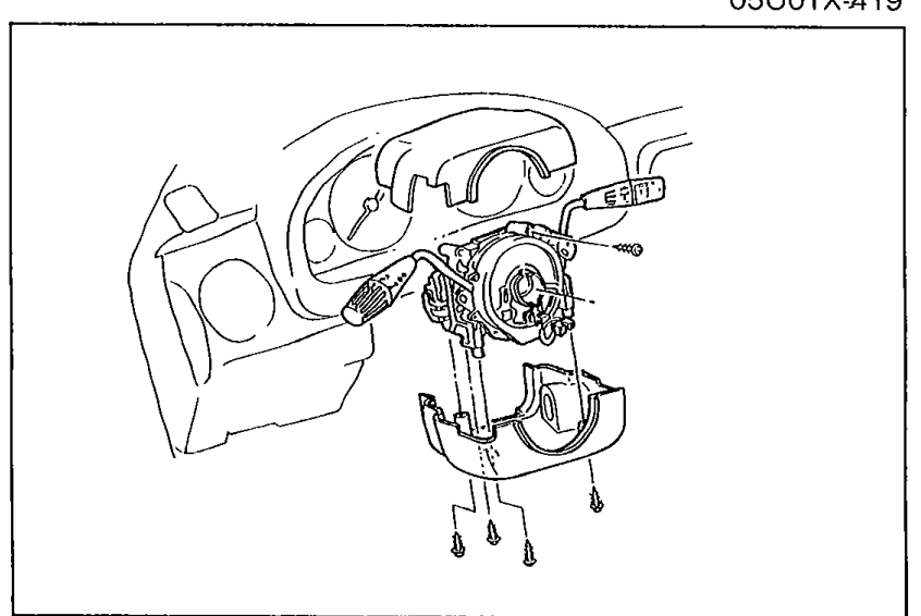 Steering column with steering wheel removed showing the clock spring connector assembly screws being loosened to remove the assembly with the combination switch.