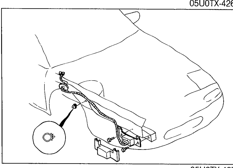 Inner front fender area showing the D-sensor (RH) mounted with clips and bolts to be removed.