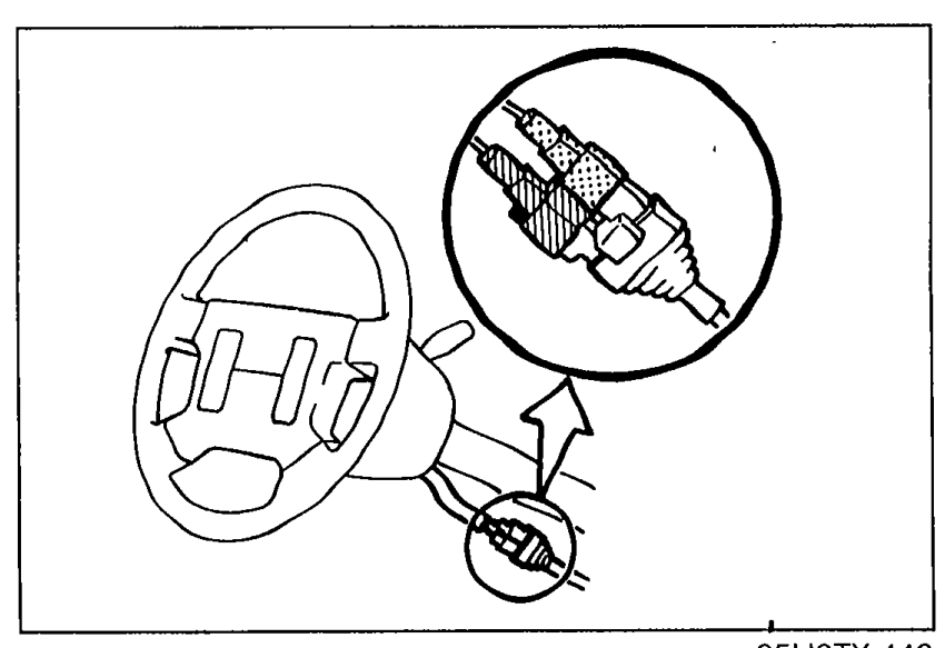 Steering wheel with a callout zoom showing the clock spring connectors (Orange and blue) being disconnected after removing the knee protector.