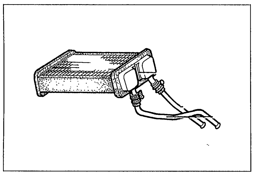 Heater core unit shown in isolation for inspection, with two coolant hose stubs visible on the left side and the finned heat-exchanger matrix on the right.