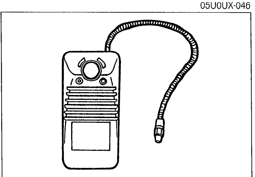 Halide gas leak detector — handheld unit with the sensing wand attached by a flexible hose. Used to check the system for refrigerant leaks per step 4.