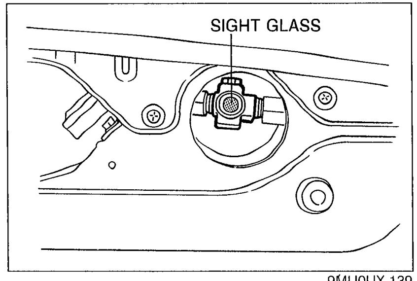 Close-up view of the receiver/drier with the sight glass on top. An arrow callout labeled 'SIGHT GLASS' points to the round sight-glass window.