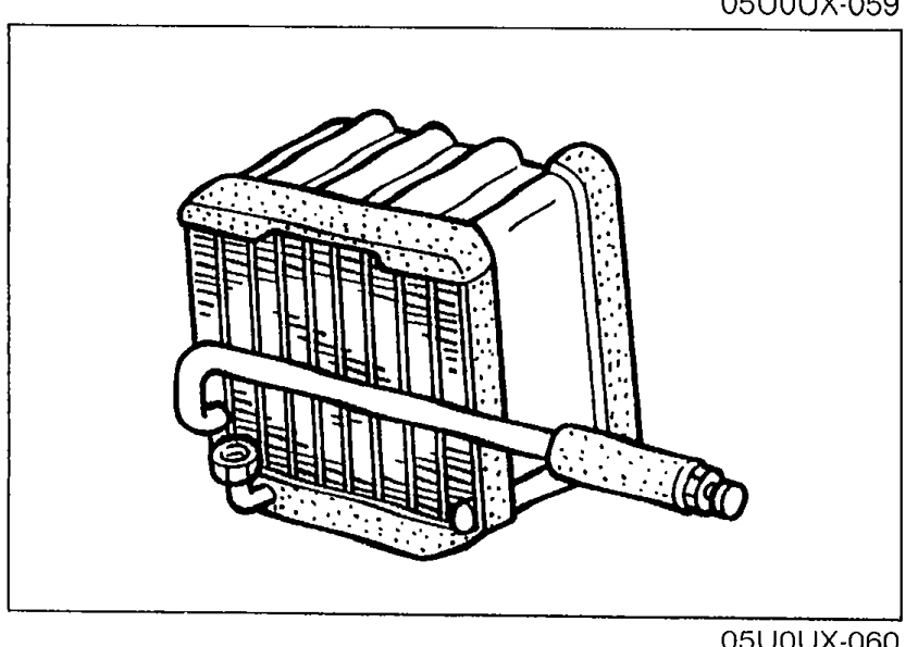 Detail view of the evaporator core with its fins and outlet pipe visible. Illustrates inspection of the evaporator fins for blockage.