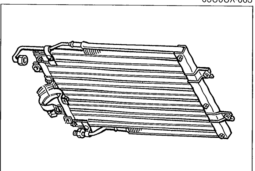 Bench view of the condenser removed from the vehicle, showing the full finned core and its inlet/outlet fittings, used to illustrate inspection for cracks, bent fins, or distorted inlet/outlet.